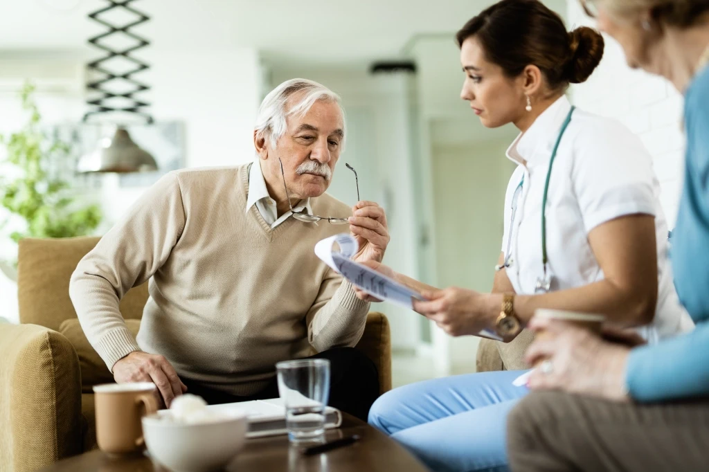 Home doctor assessing a patient with common non emergency illness during an after hours visit in Australia